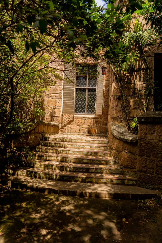 steps leading up to an open door and windows