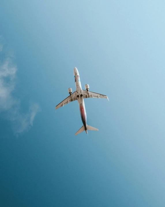 the large passenger jet is flying in the sky