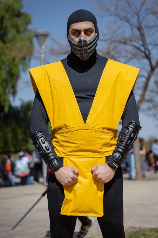 a guy dressed in a yellow and black outfit