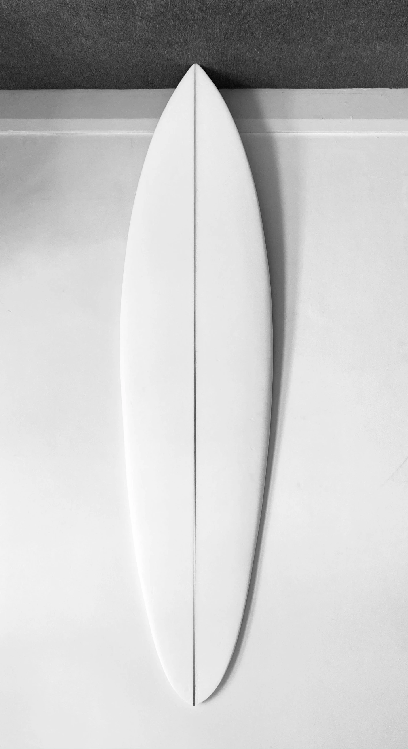 a surfboard on the wall in a room