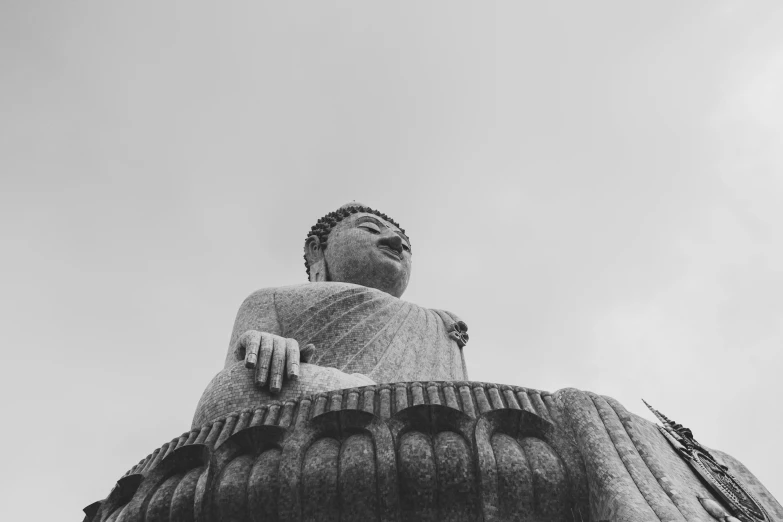 a statue that looks like a person sitting down