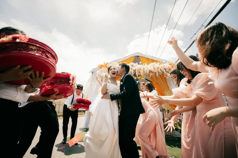 a bride and groom are throwing confetti at each other