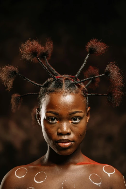 an image of a young black girl with weird hair