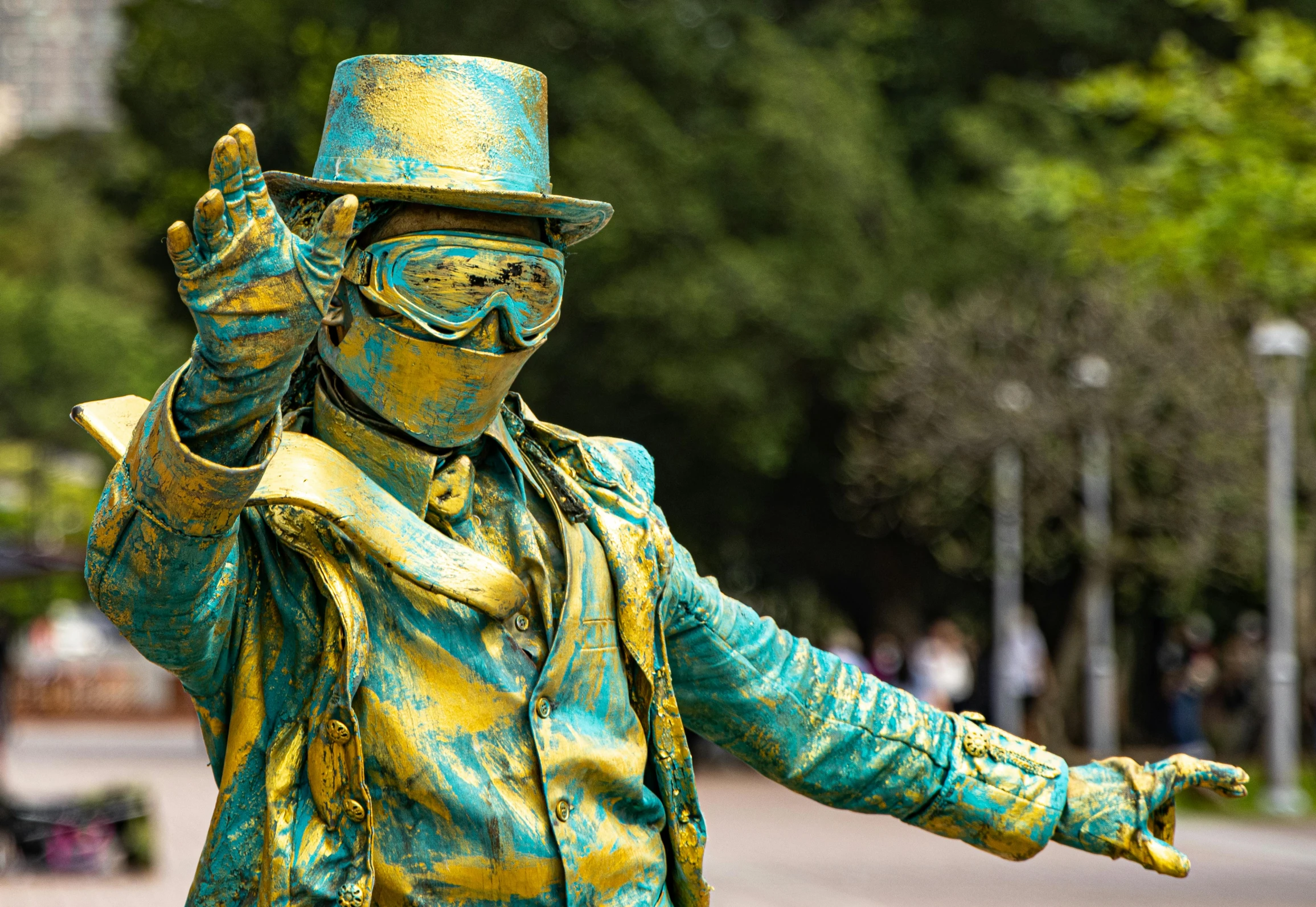 a man with painted clothes and a hat on the street