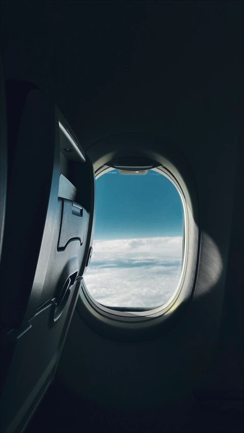 a jet window with a view out the plane window