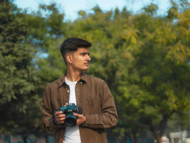 man taking picture in open area with camera