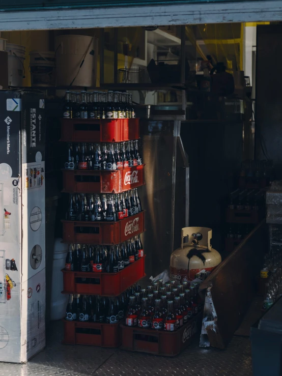 beer cans and a cooler stacked up outside