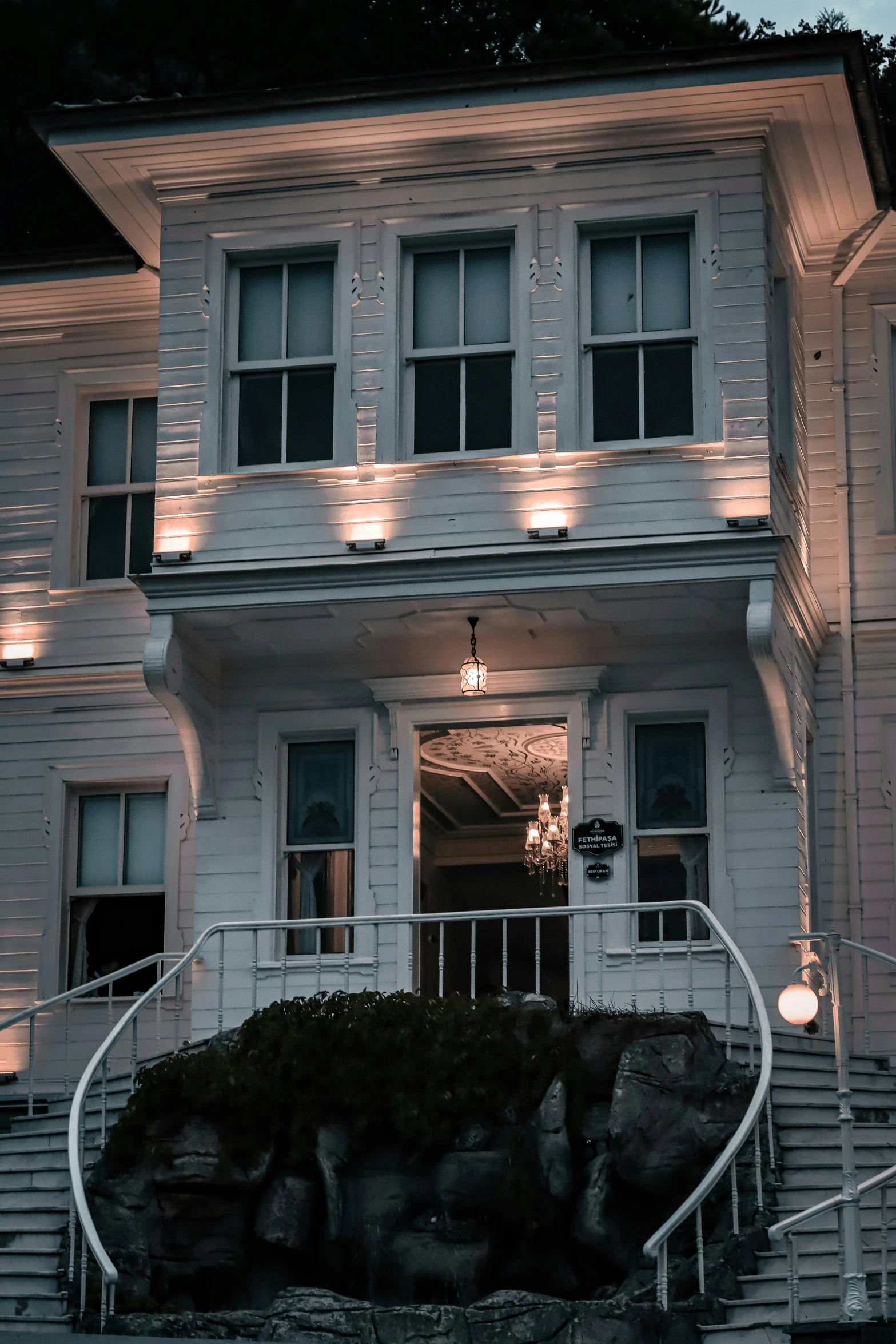 a building with several lights that are on the windows