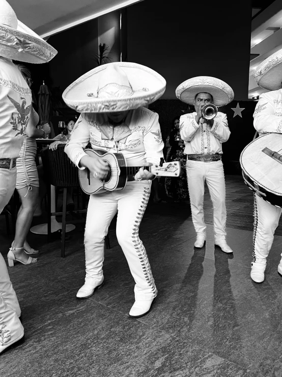 group of people in costumes playing instruments and singing