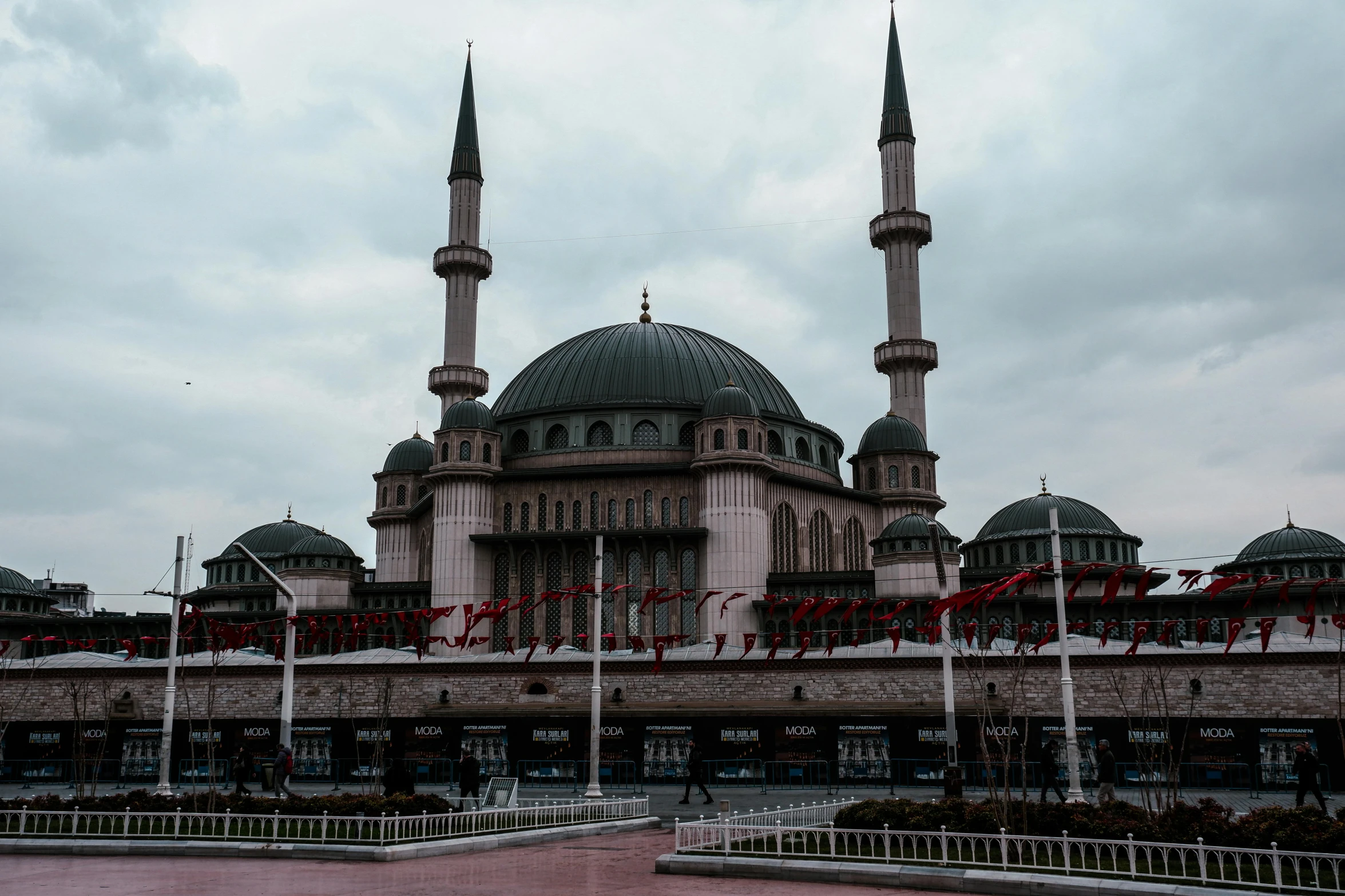 a tall building with two towers that are painted blue