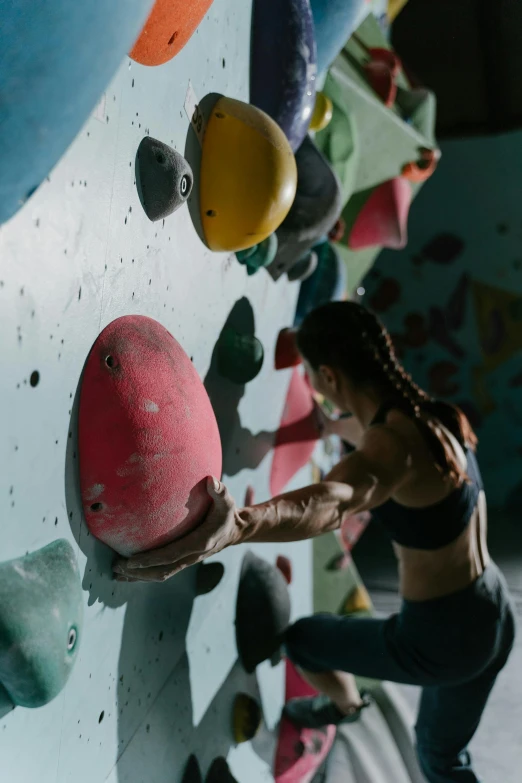 a person climbing on a rock wall