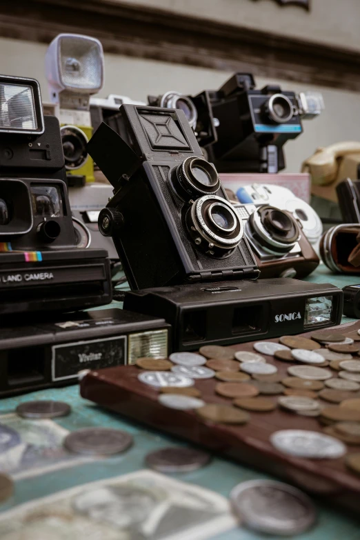 cameras on display with the one in the foreground and the other behind them