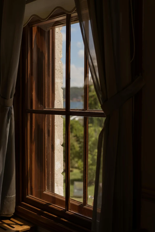 a window with a view of a valley