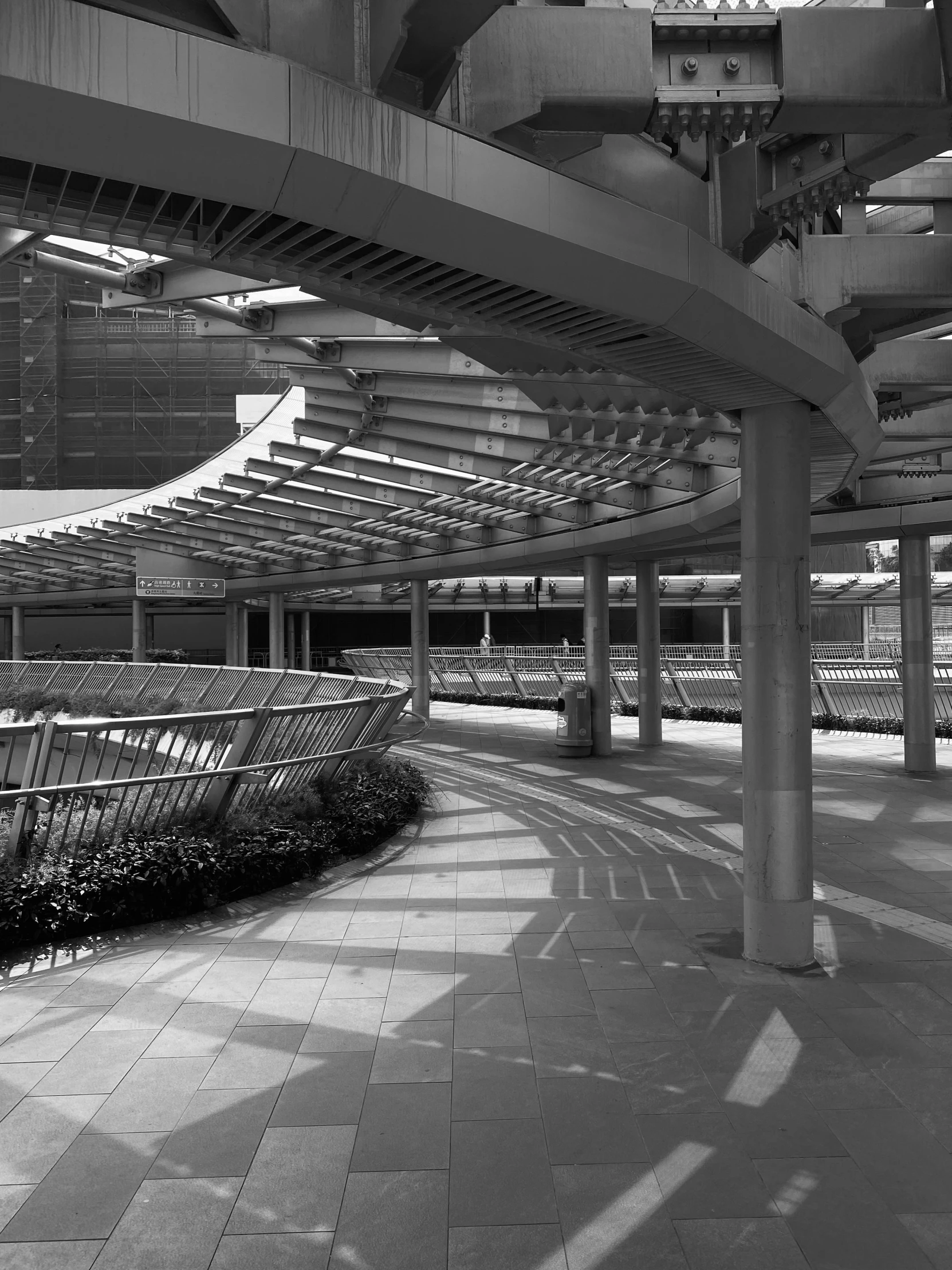 a group of benches under the arches of an airport terminal