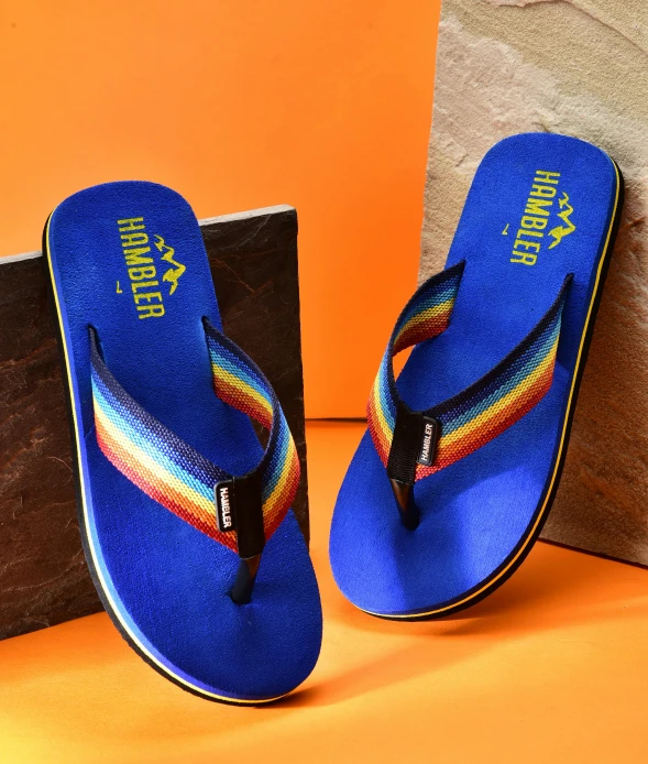 blue flip flops in front of a bag