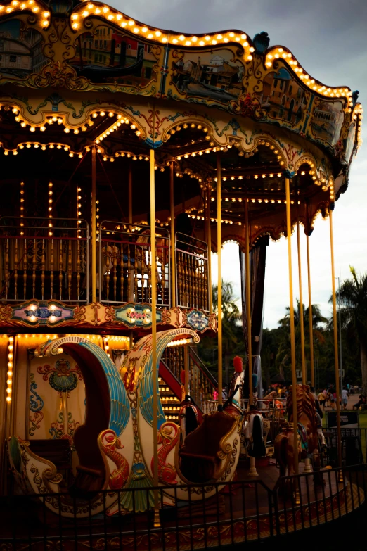 an old fashioned colorful merry go round in the sun