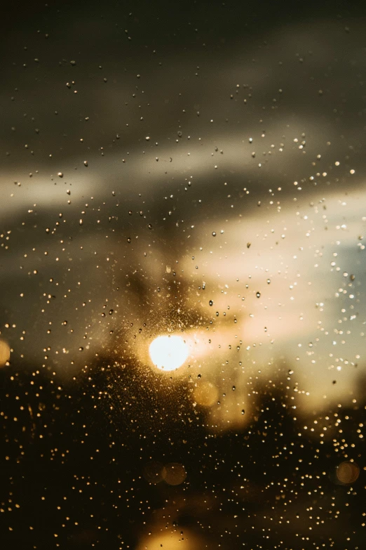 rain drops are falling on a car window