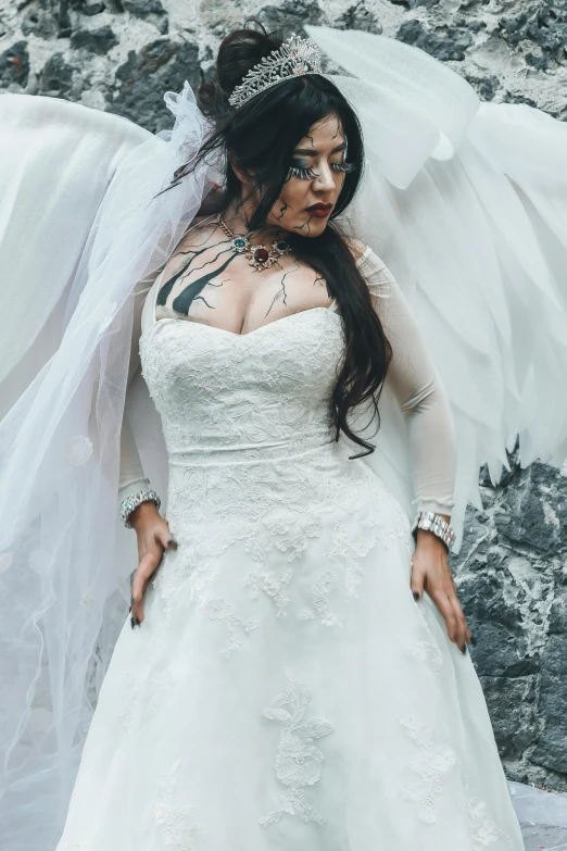 a woman wearing a wedding dress and veil