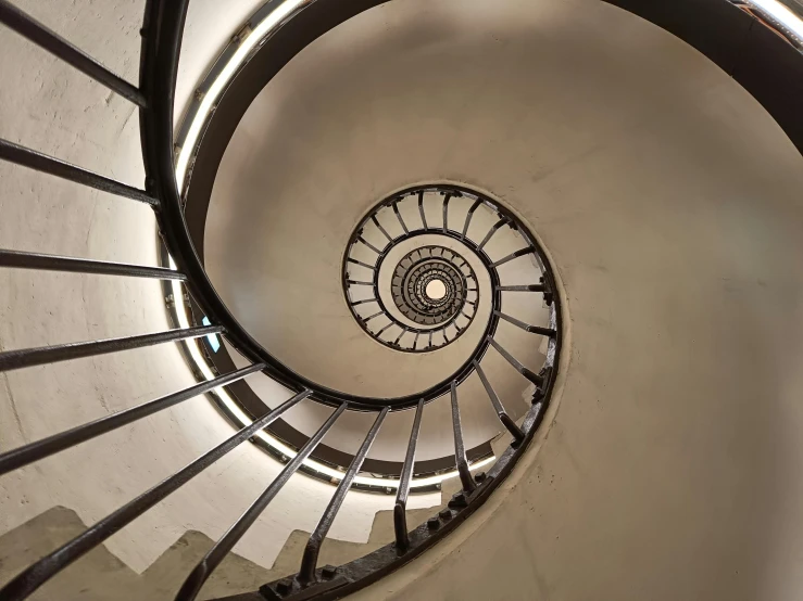 the bottom of a spiral stair - way