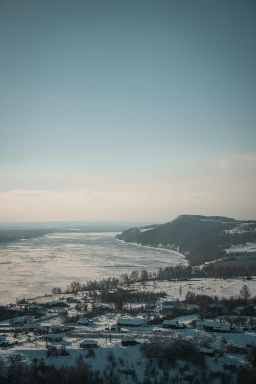 a river and some mountains in the background