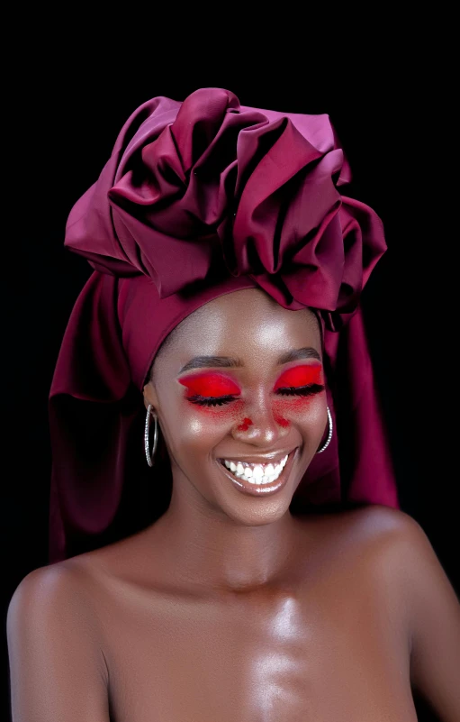 the woman is smiling and wearing red makeup