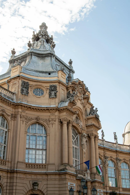 a beautiful building with lots of windows and a sky background