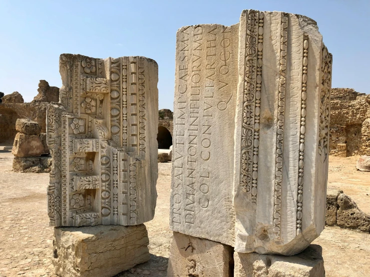 two stone blocks sitting on top of dirt