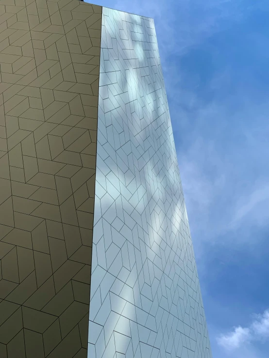 an upward view of two triangular architectural designs