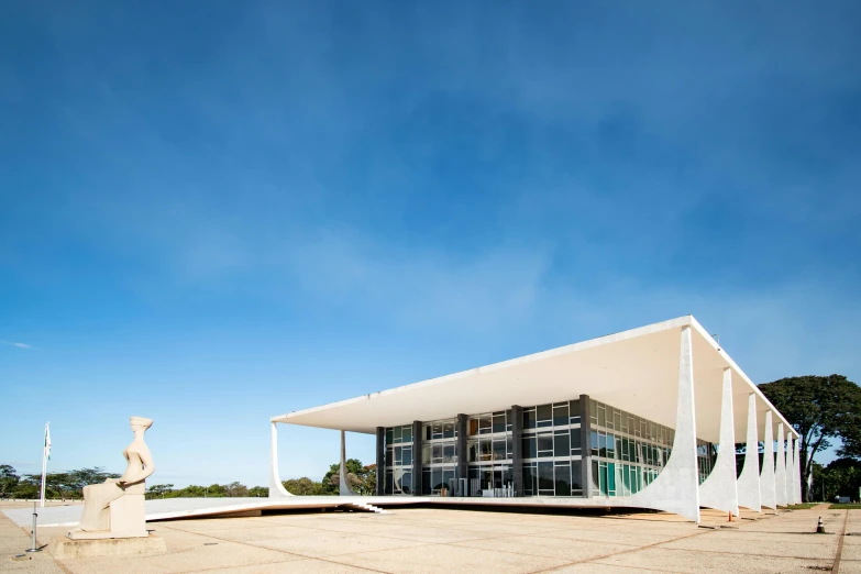 a white building with columns in front of it