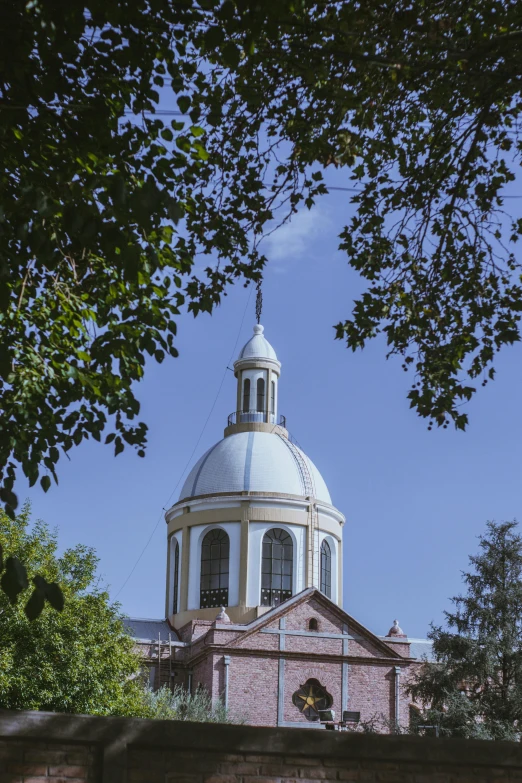 a church with a tower and a large clock on it