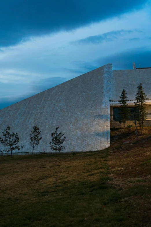 the building is designed like a pyramid with a roof