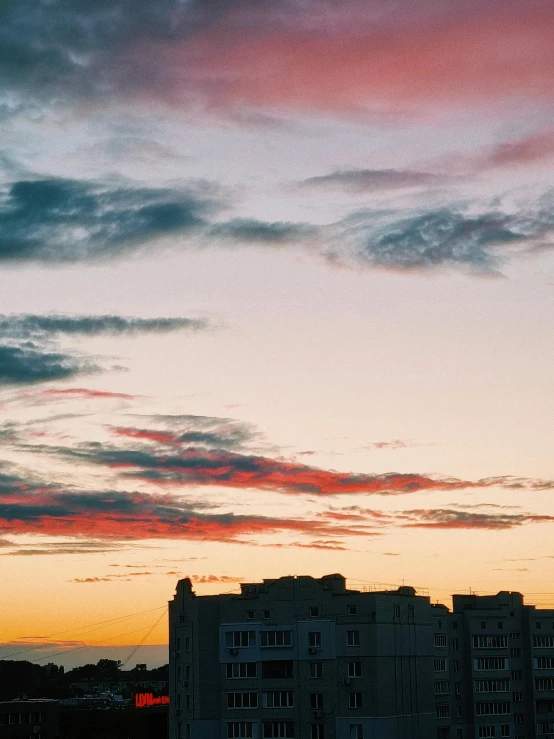 the sky with clouds that are pink and red