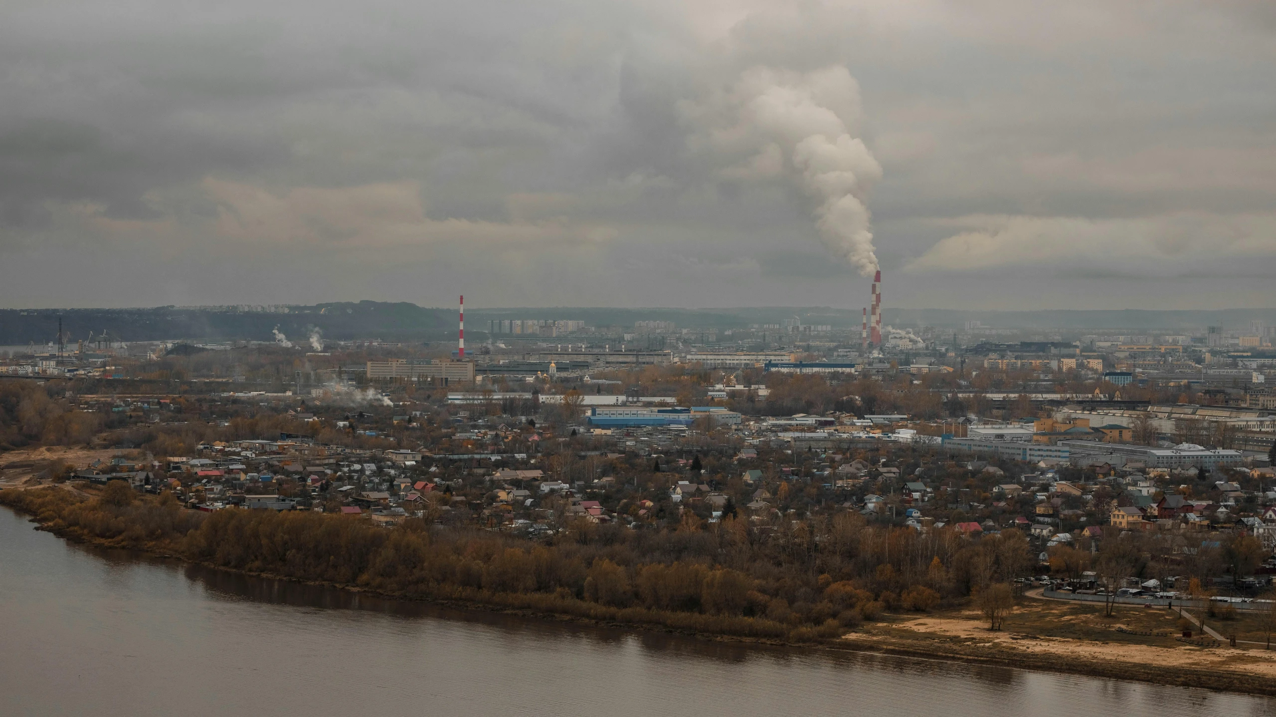 a large factory smoking smokes into the distance