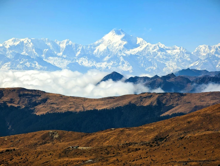 the snow capped mountains are in the distance