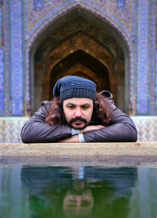 a man laying down in a pool of water