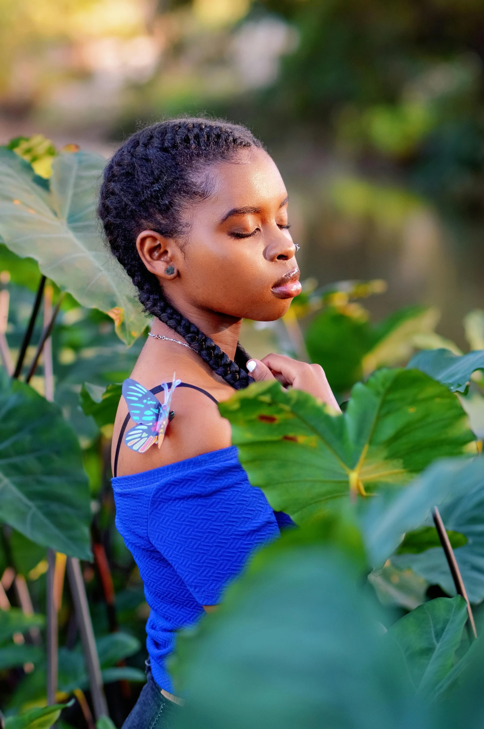 a  standing in the forest blowing her nose