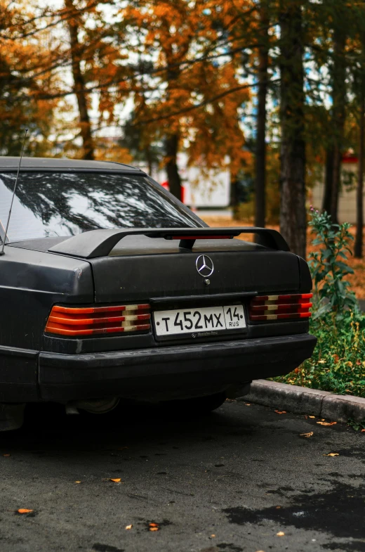 this is an old mercedes 300 sl slk parked by trees