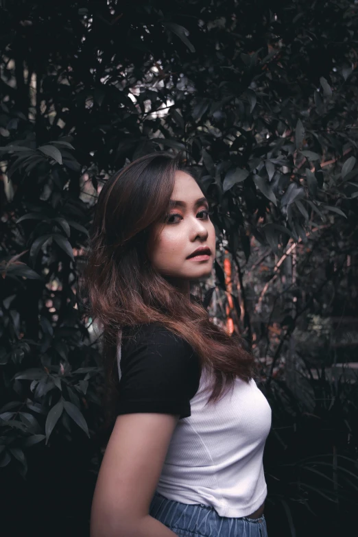 a woman wearing a black and white shirt