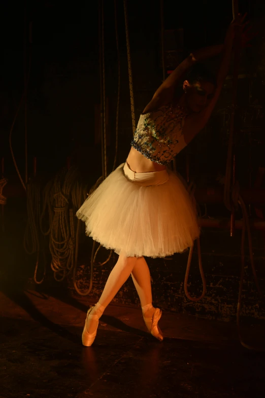 a woman is dancing on the stage with her feet