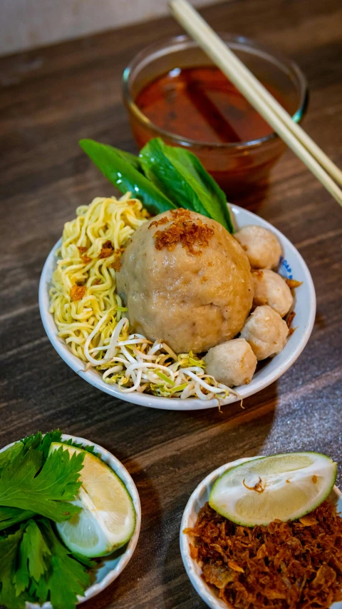 two bowls filled with food sit on top of a table