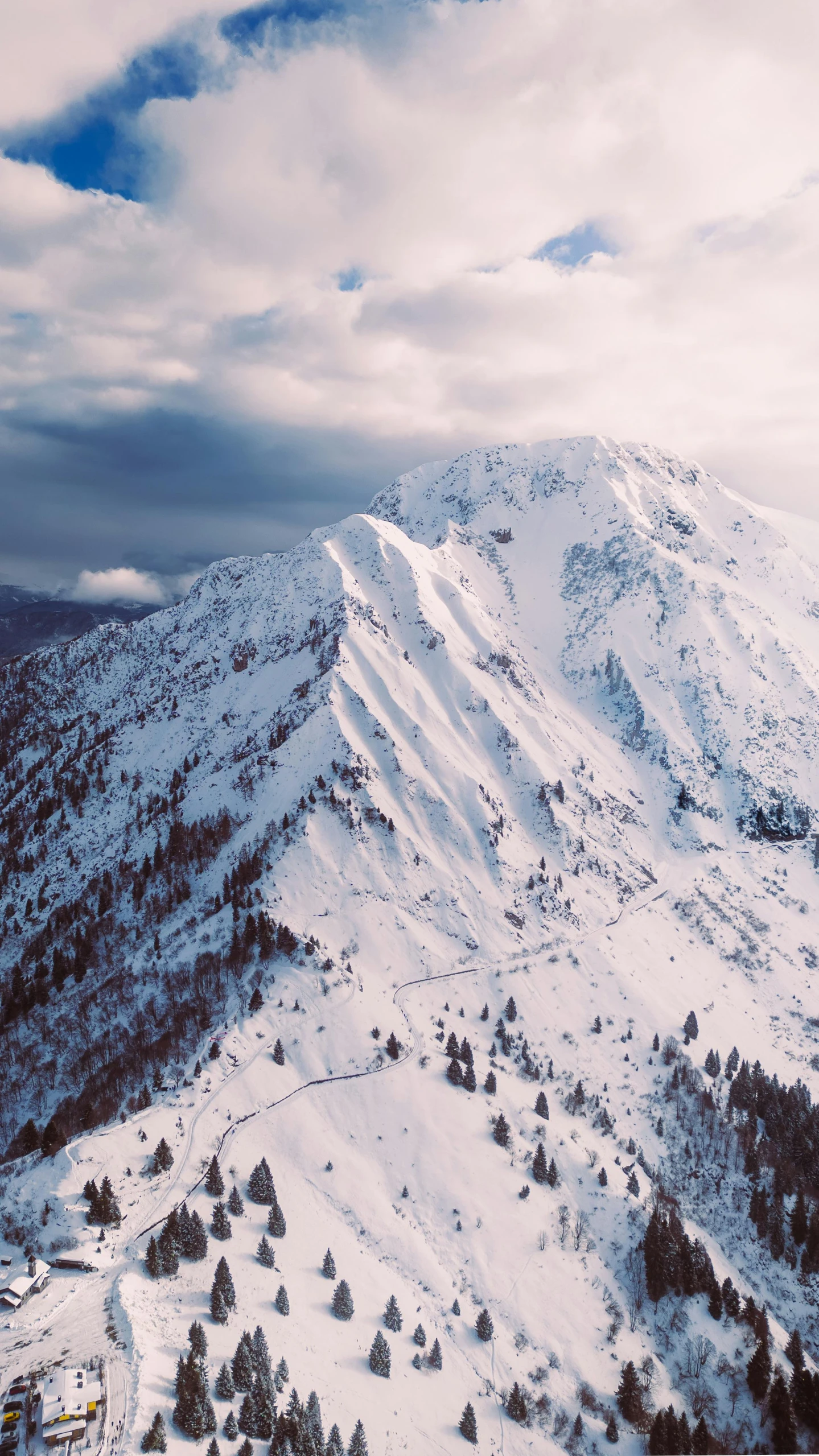 view over a snowy mountain with a sky background