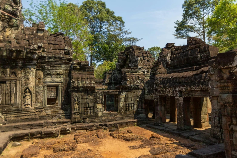 several ruins at a building in a tropical region