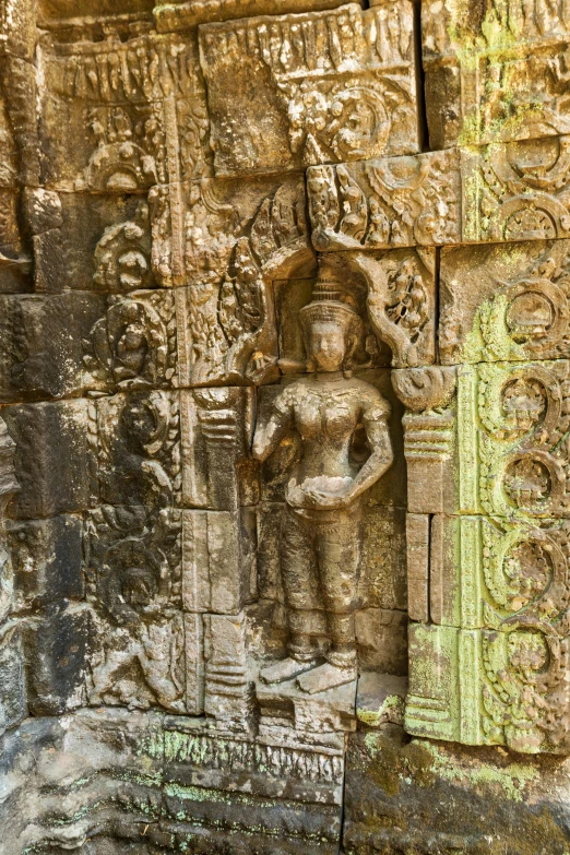 carving of the god in an intricate stone design