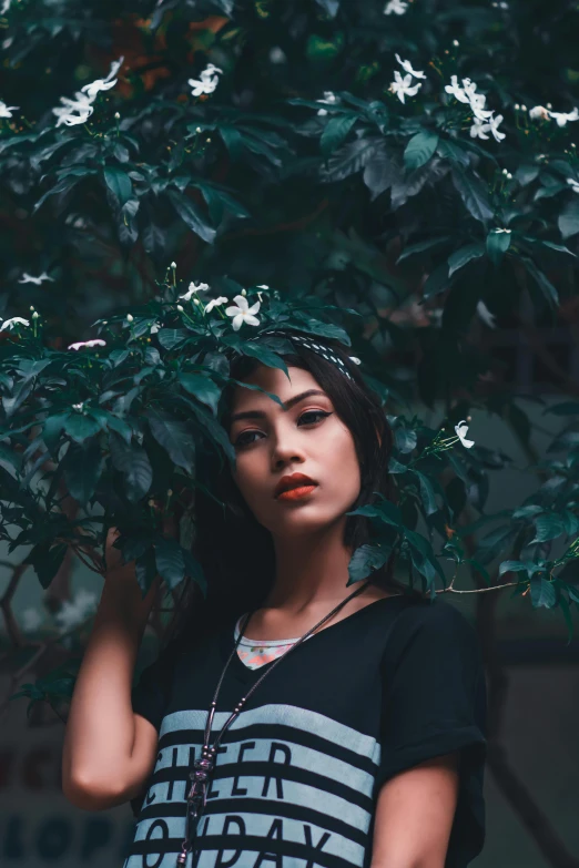 an image of a woman holding a tree in her hands