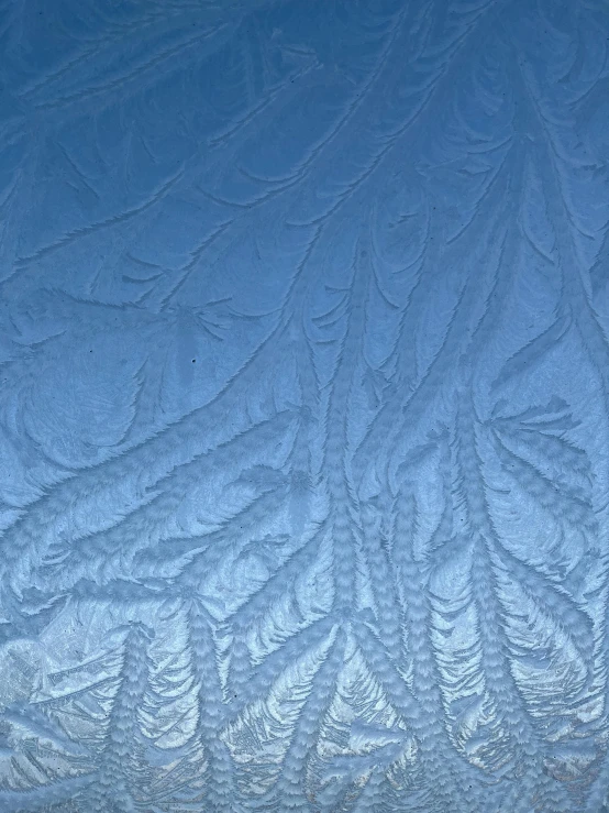 snow patterns are shown on the top of a window