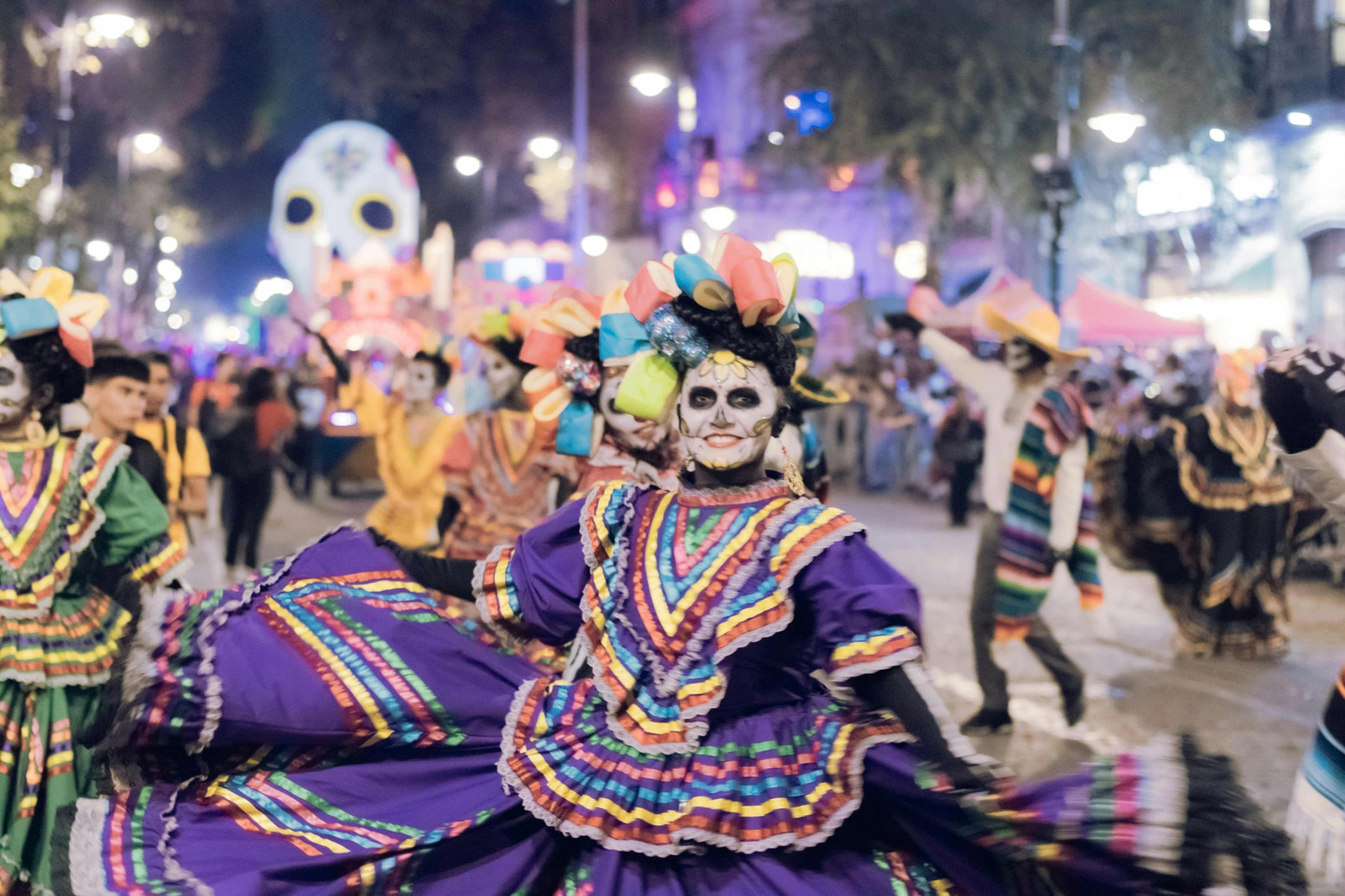 a group of people dancing around in costumes