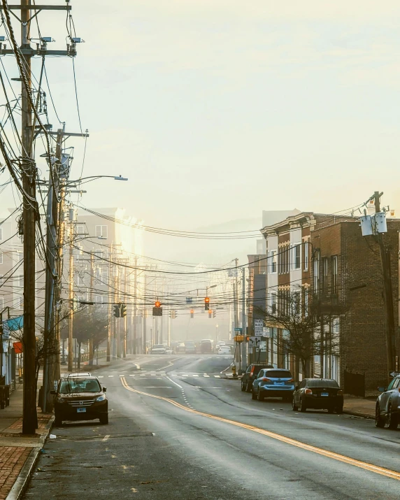 cars sit parked on the side of the street