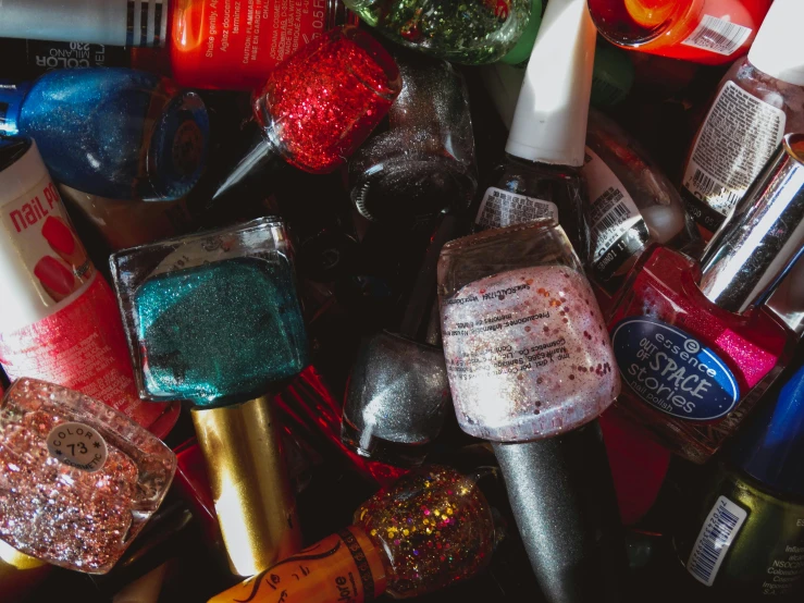 a group of bottles and bottles of different colors