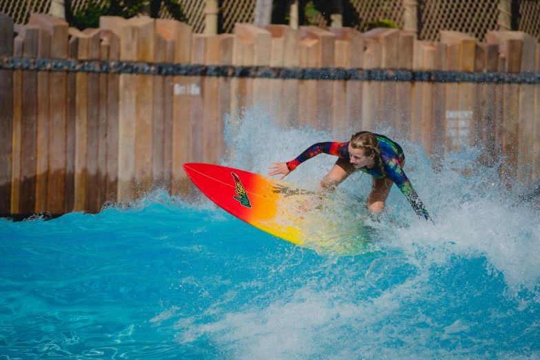 the surfer takes a turn on his surfboard