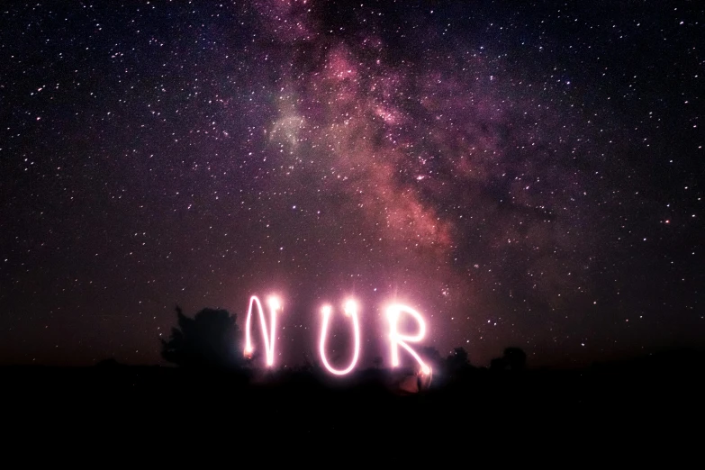 fireworks and the sky with words nur above it